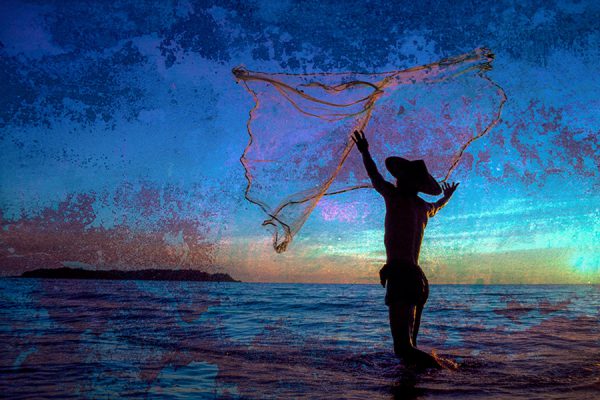 Fisherman casting his net